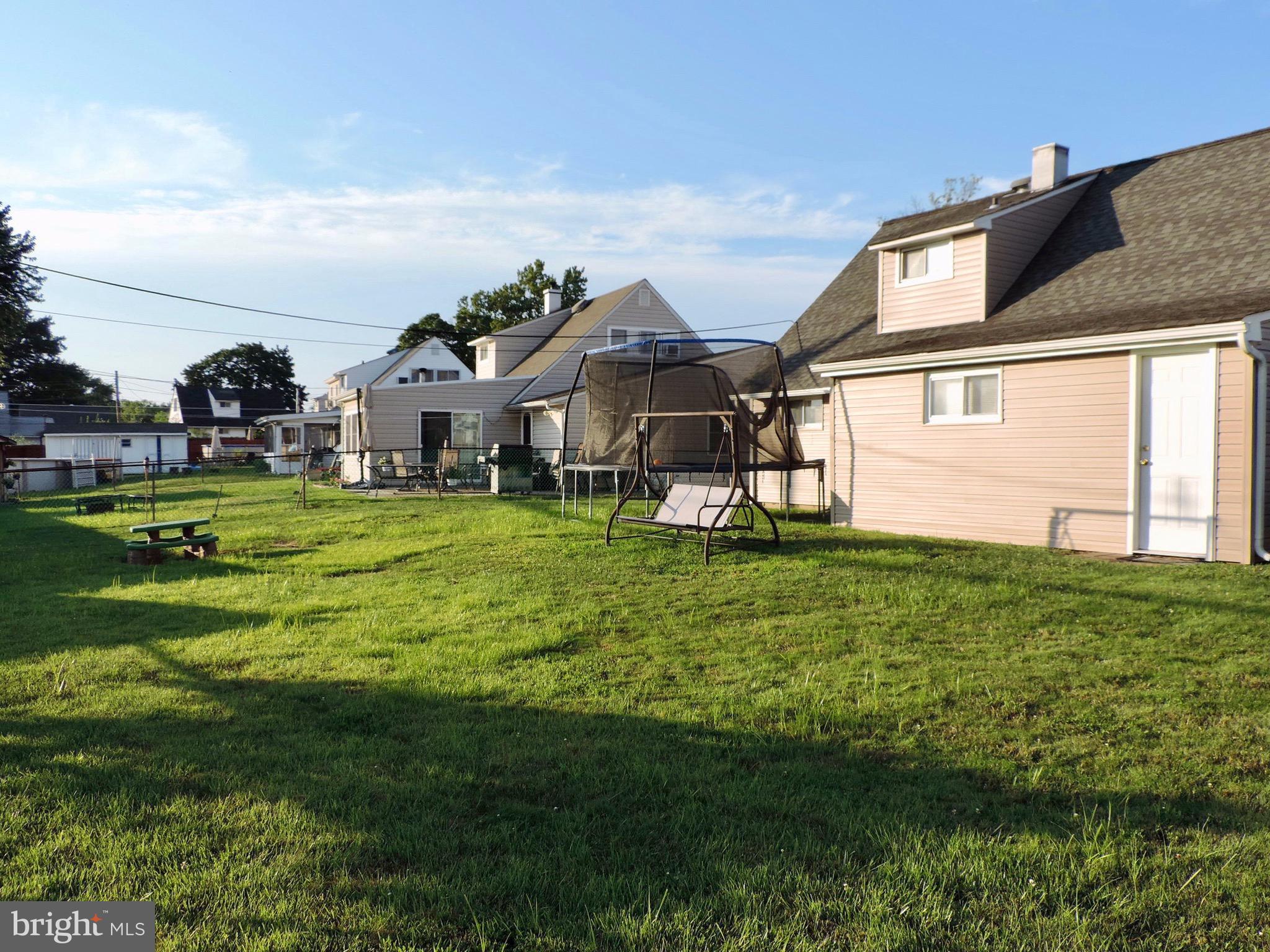 3 Margin Road Levittown, PA 19056 - Photo 18 of 19 Large wide-open yard with fencing and great lawn.