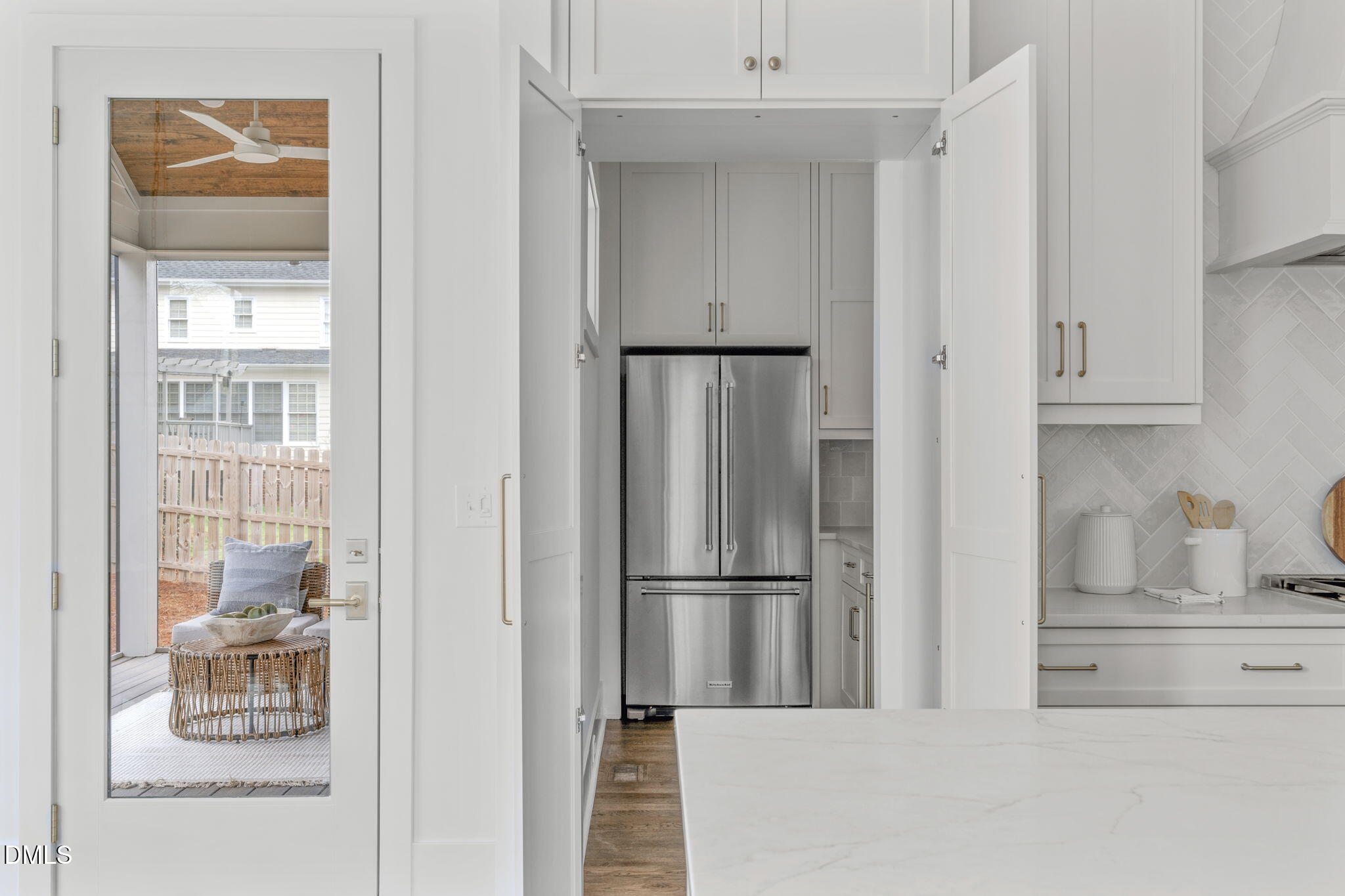 806 Tyrrell Road Raleigh, NC 27609 - Photo 11 of 38 a kitchen with a refrigerator and cabinets