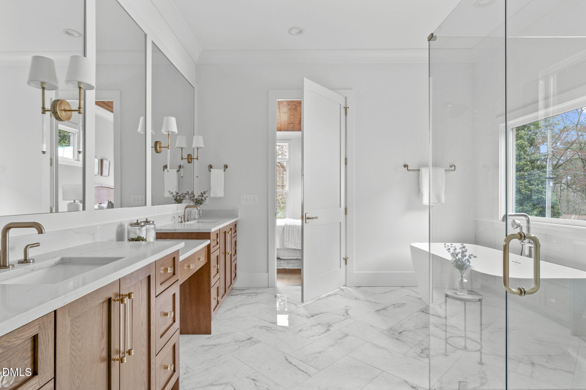 806 Tyrrell Road Raleigh, NC 27609 - Photo 17 of 38 a spacious bathroom with a shower sink and mirror
