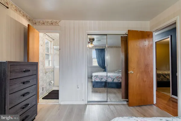 a bathroom with a sink a toilet and a shower