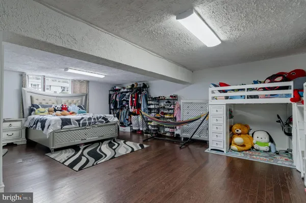 a living room with lots of furniture and a book shelf