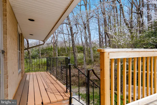 a view of deck with wooden floor and outdoor seating