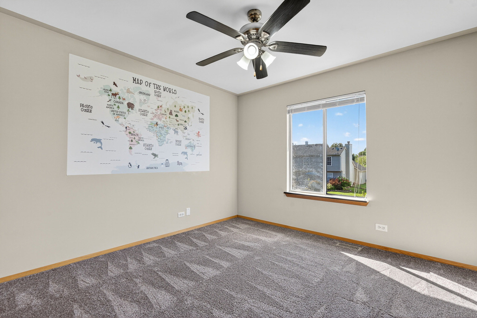 995 Longford Road Bartlett, IL 60103 - Photo 18 of 25 an empty room with a window and a ceiling fan