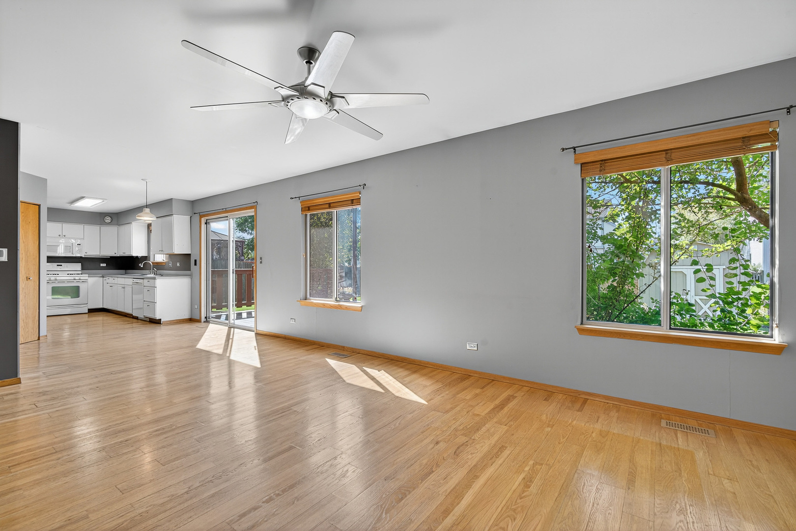 995 Longford Road Bartlett, IL 60103 - Photo 9 of 25 a view of an empty room with a window and wooden floor