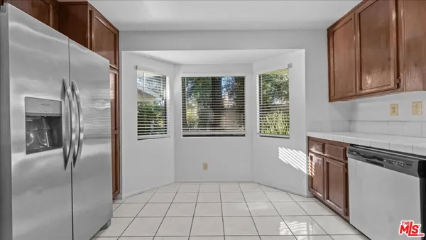 a view of an empty room with a fireplace