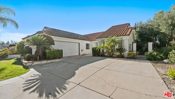 a view of a front of a house with a yard
