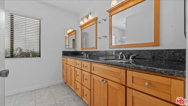 a bathroom with a glass shower door