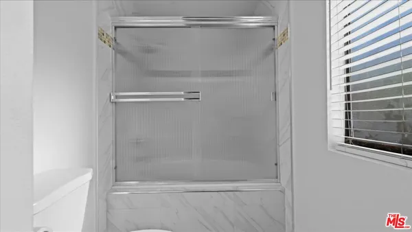 a view of empty room with windows