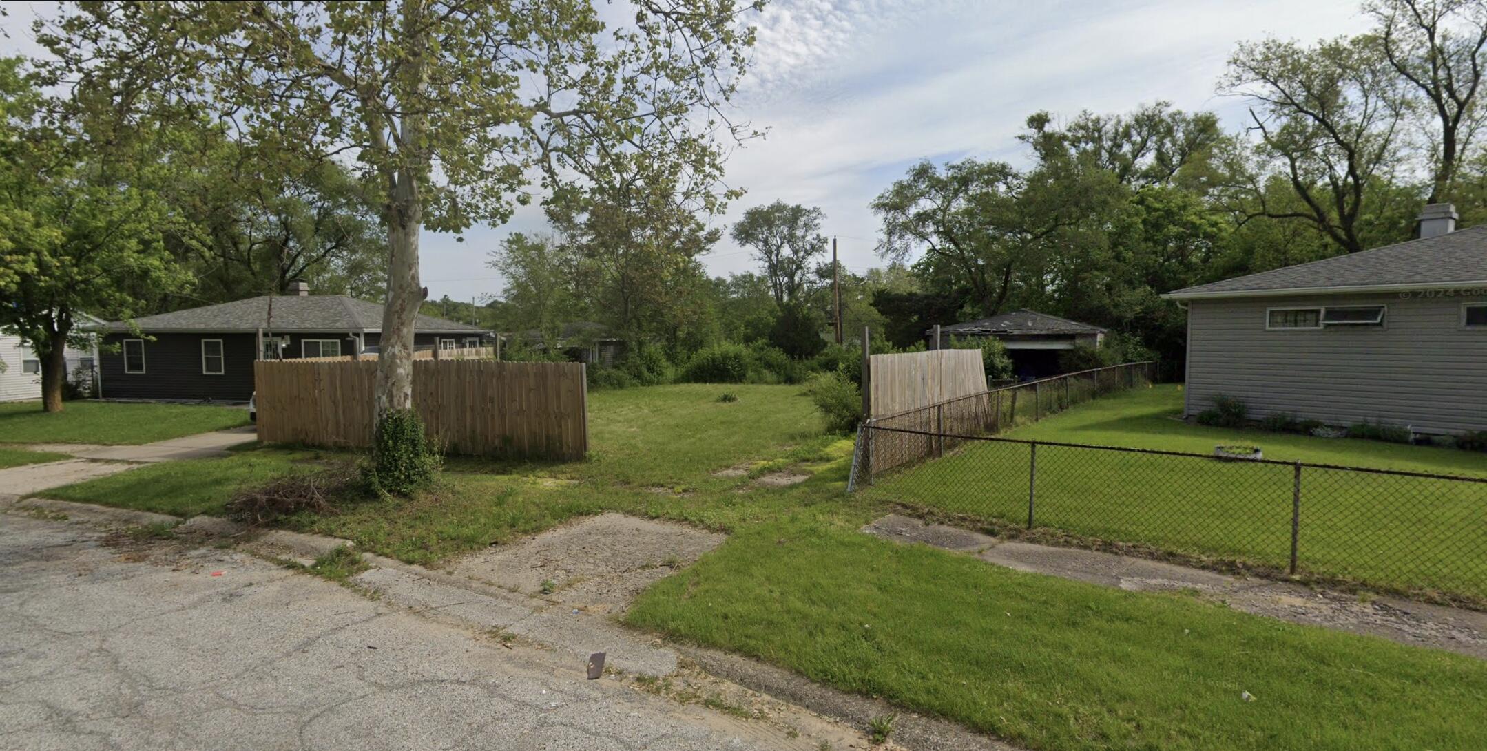 2083 Williams Street Gary, IN 46404 - Photo 1 of 2 a view of a backyard with wooden fence