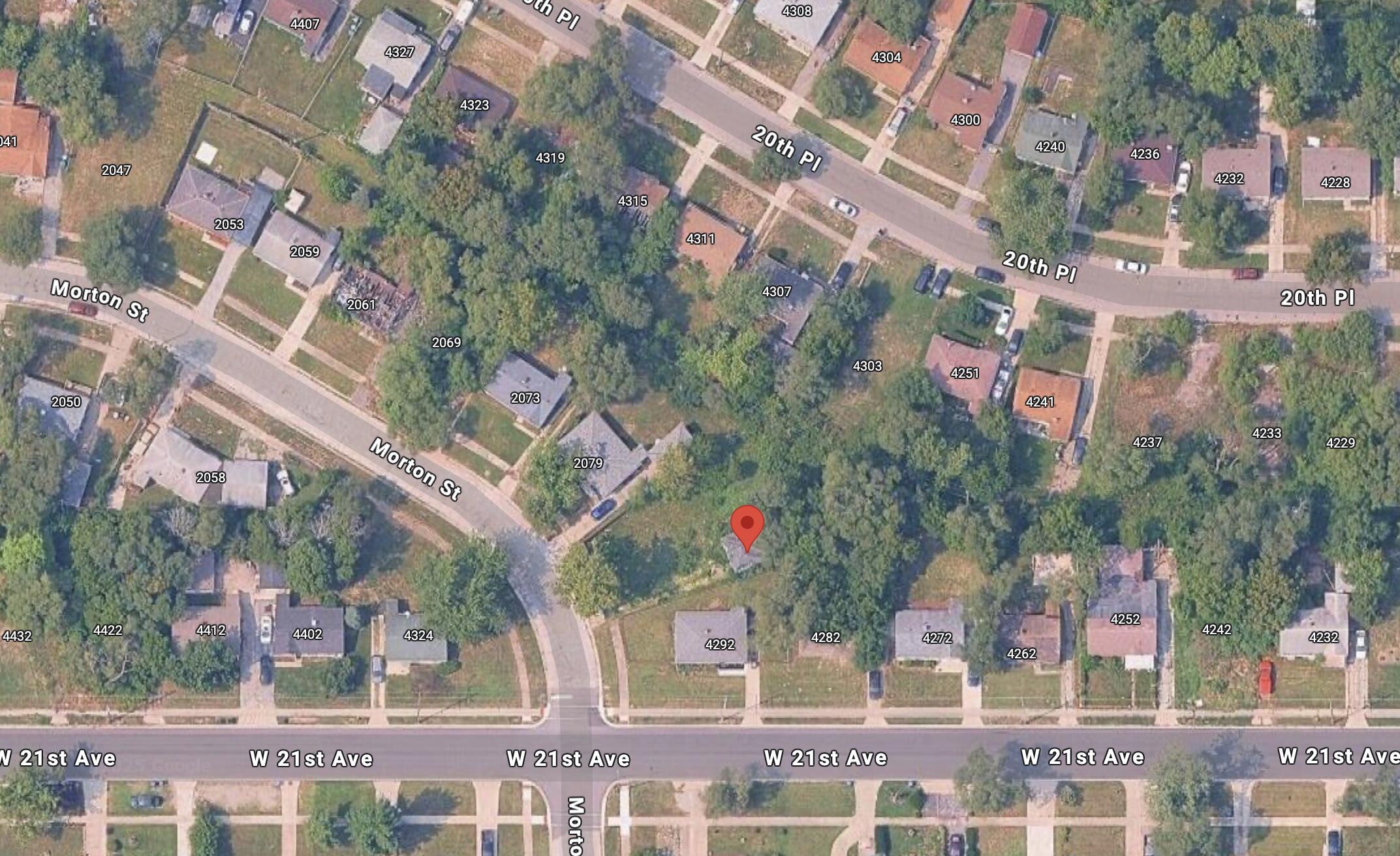 2083 Williams Street Gary, IN 46404 - Photo 2 of 2 a front view of a multi story building with yard