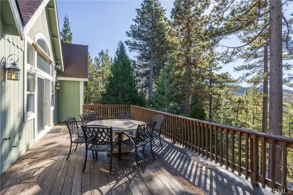 a view of a chairs and table on the balcony