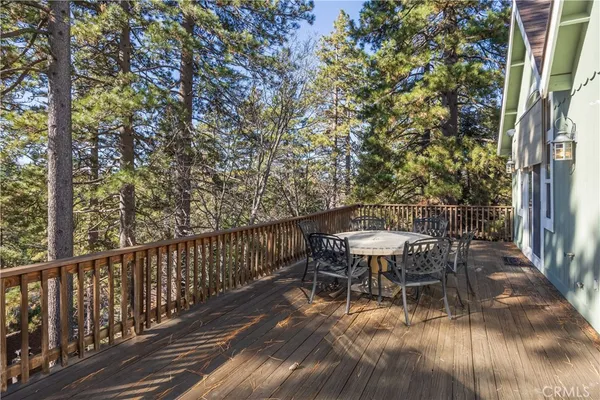 a view of a table and chairs in the balcony