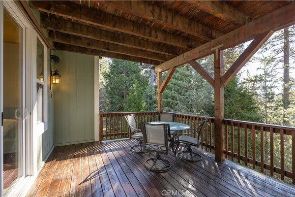 a view of porch with furniture and wooden floor