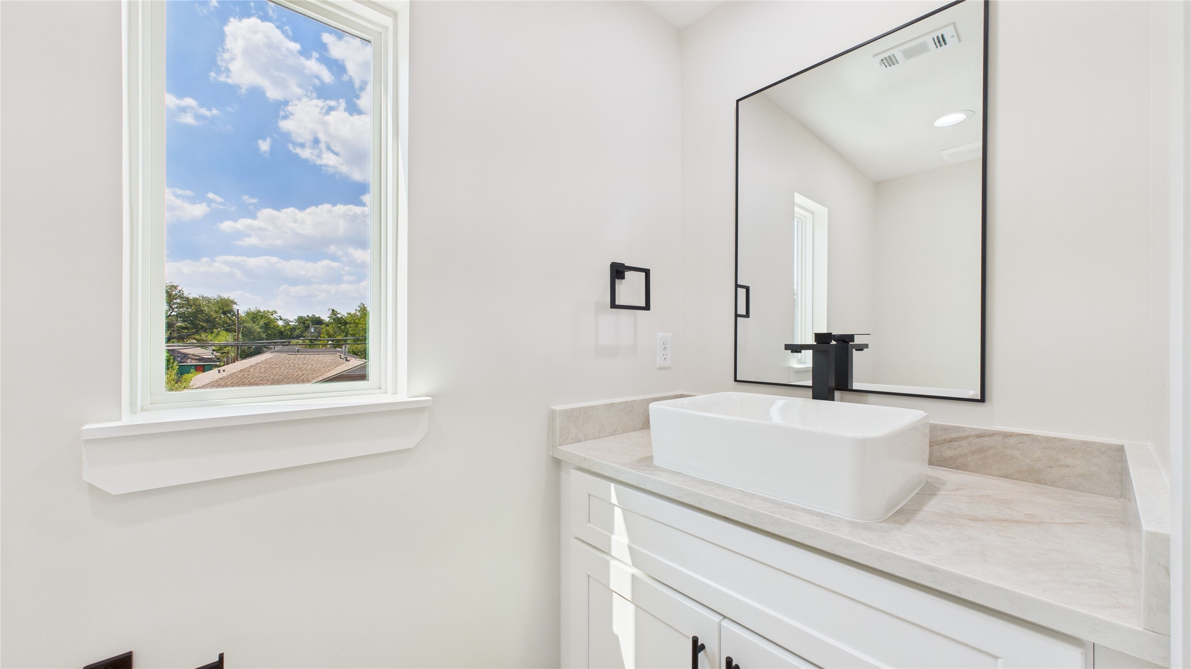 4506 Robertson Street Houston, TX 77009 - Photo 14 of 25 a bathroom with a sink and a mirror