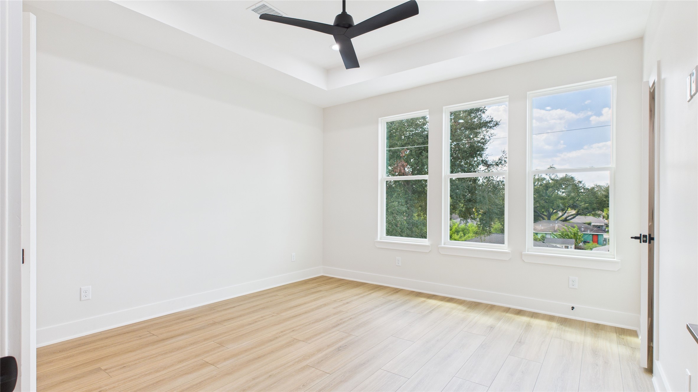 4506 Robertson Street Houston, TX 77009 - Photo 18 of 25 an empty room with a window and a ceiling fan