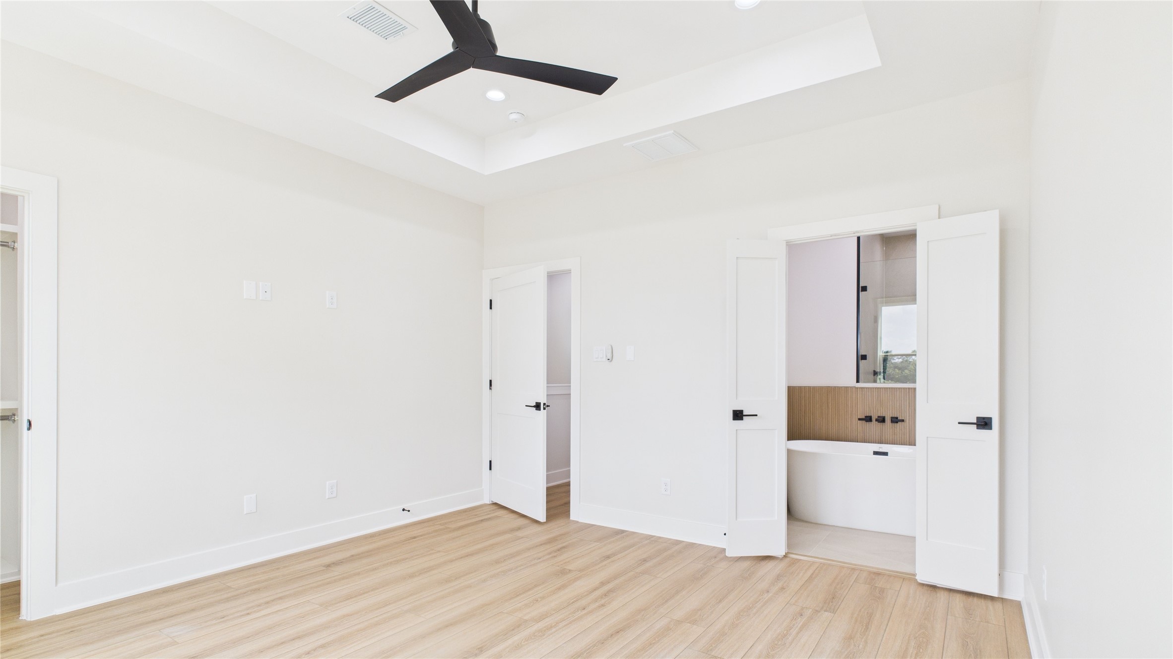 4506 Robertson Street Houston, TX 77009 - Photo 21 of 25 a view of a hallway with wooden floor and closet