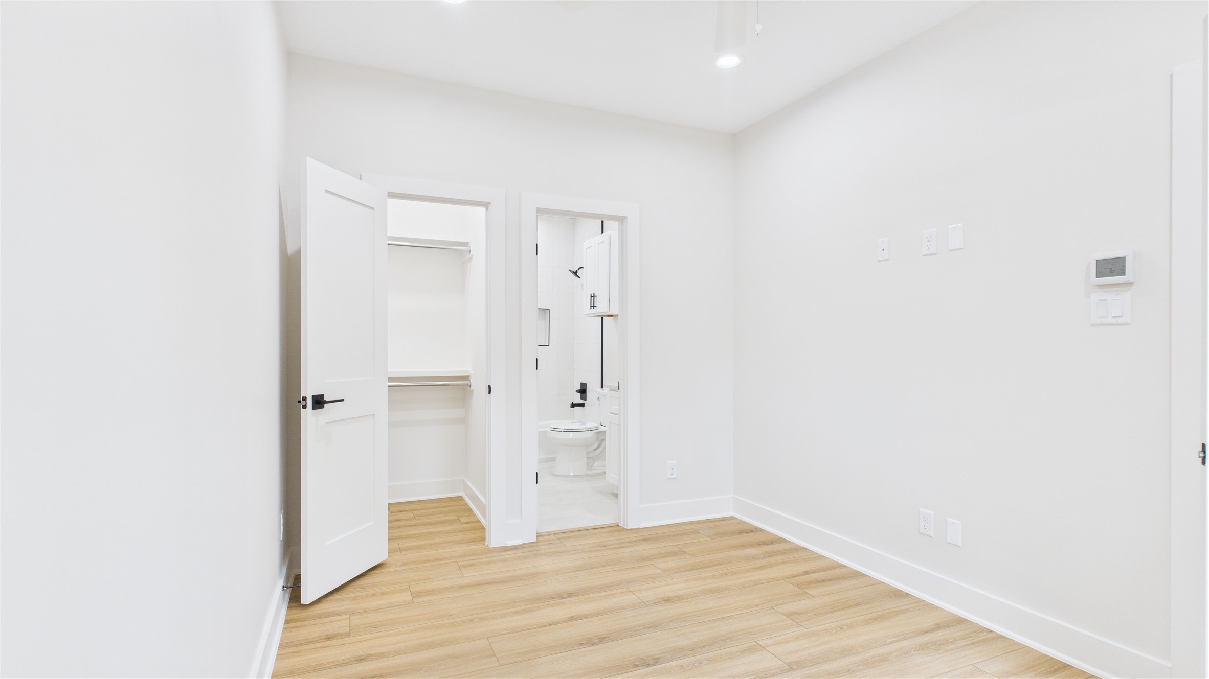 4506 Robertson Street Houston, TX 77009 - Photo 4 of 25 a view of empty room with wooden floor