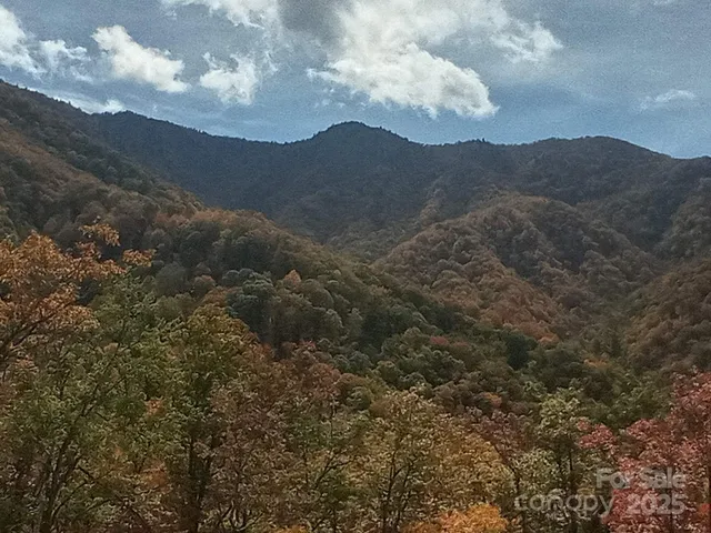 a view of a building with a mountain