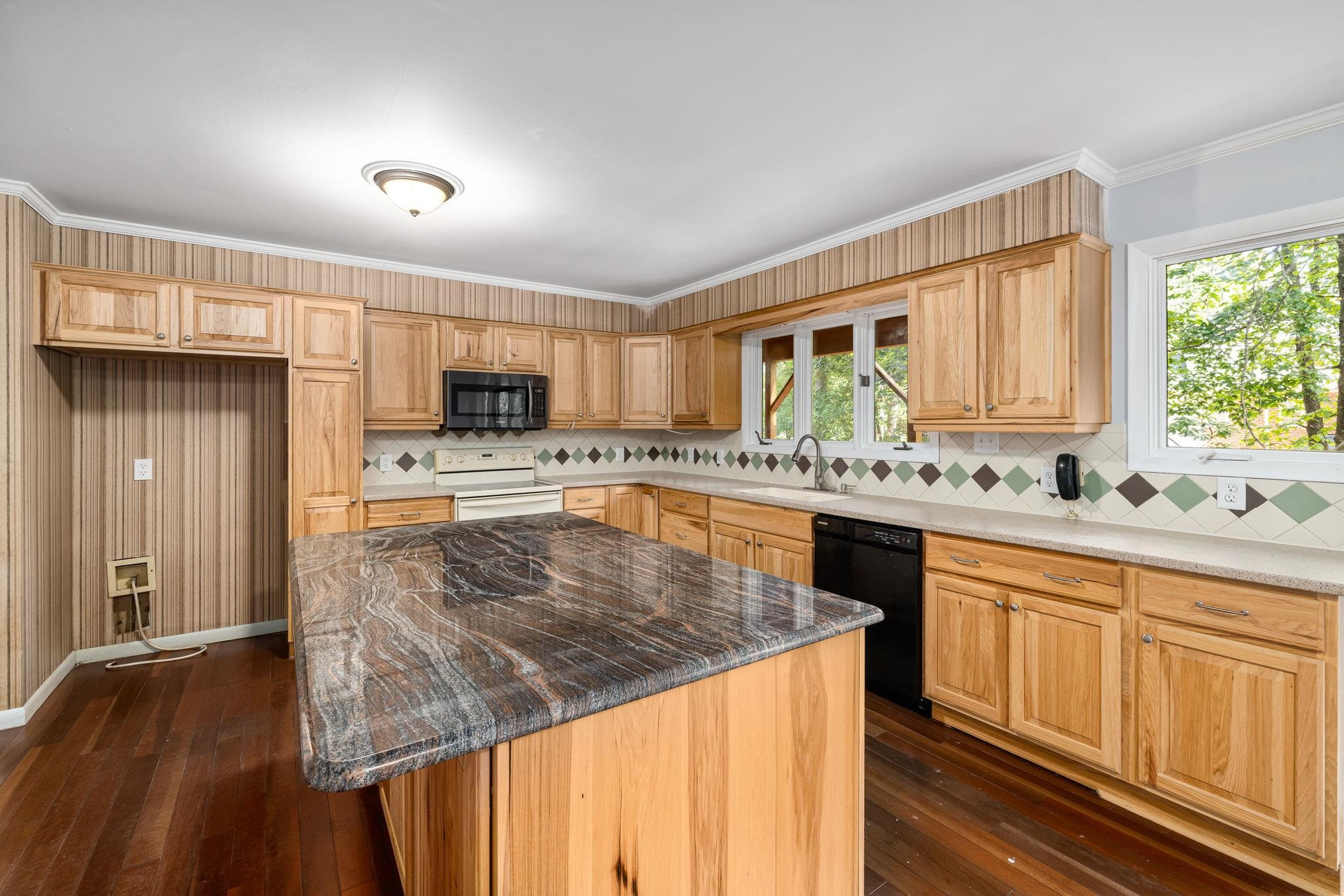 8028 Mourning Dove Road Raleigh, NC 27615 - Photo 11 of 35 a kitchen with stainless steel appliances granite countertop a sink a stove and a refrigerator