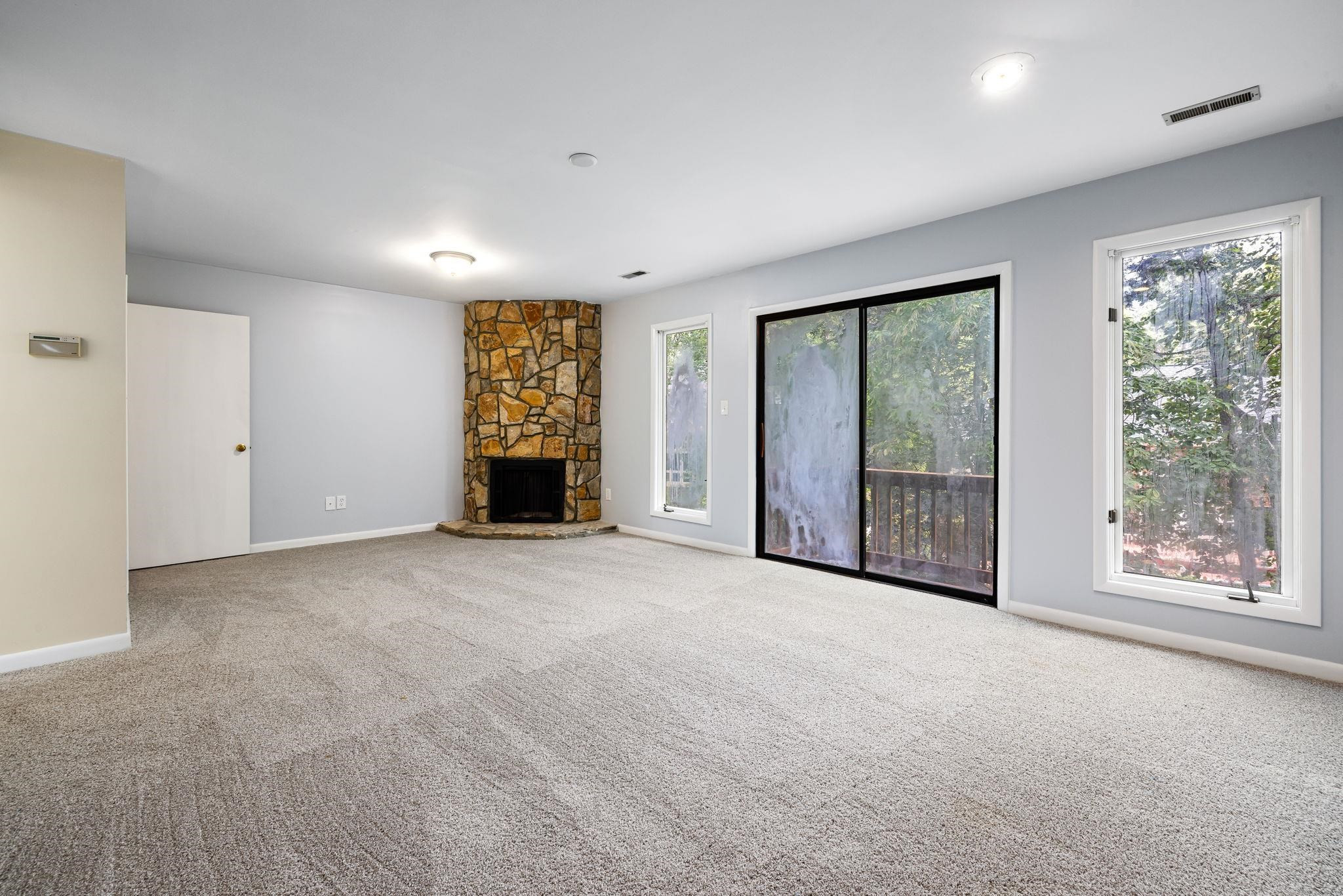 8028 Mourning Dove Road Raleigh, NC 27615 - Photo 16 of 35 a view of an empty room with windows and closet