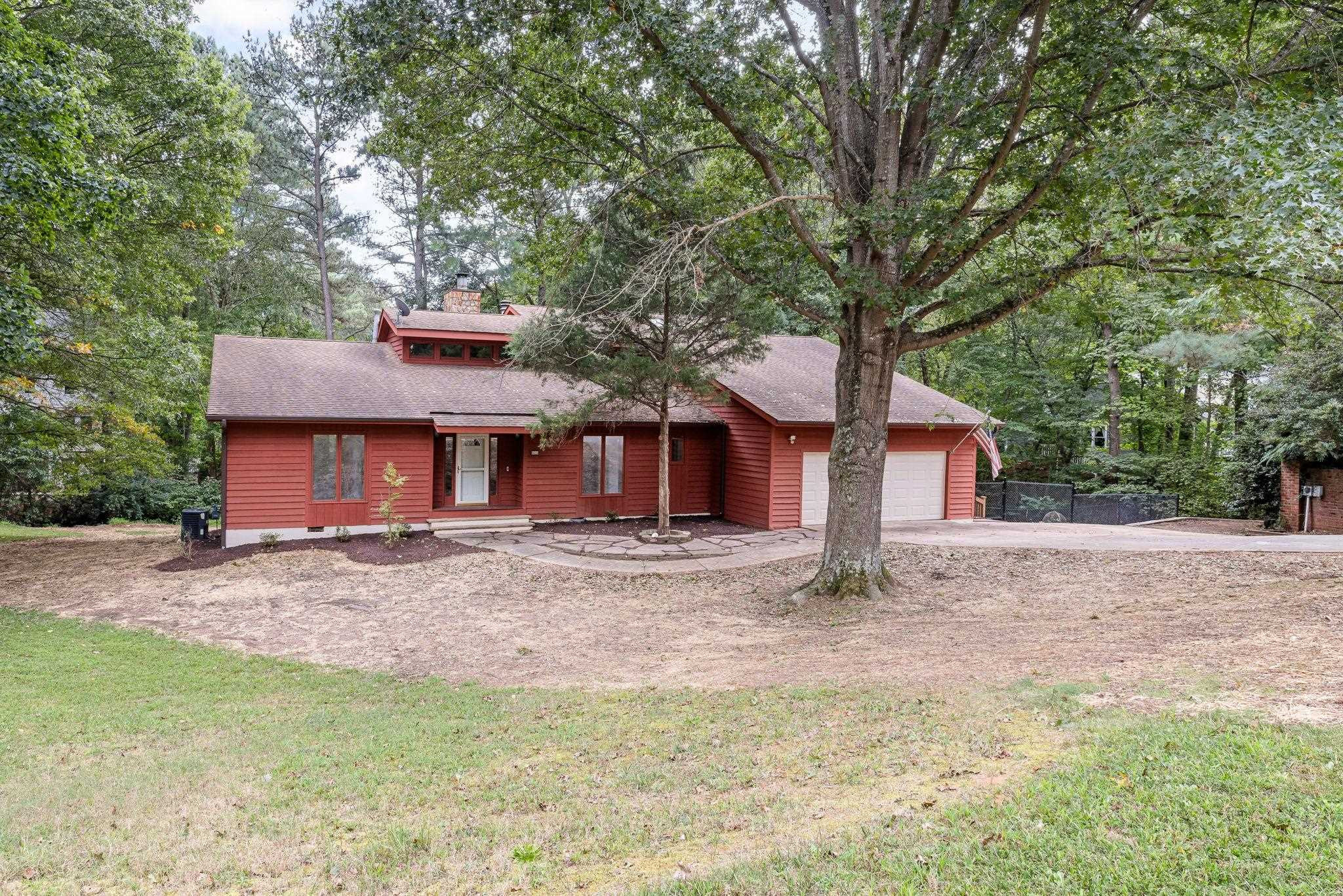 8028 Mourning Dove Road Raleigh, NC 27615 - Photo 2 of 35 a front view of a house with a yard and garage