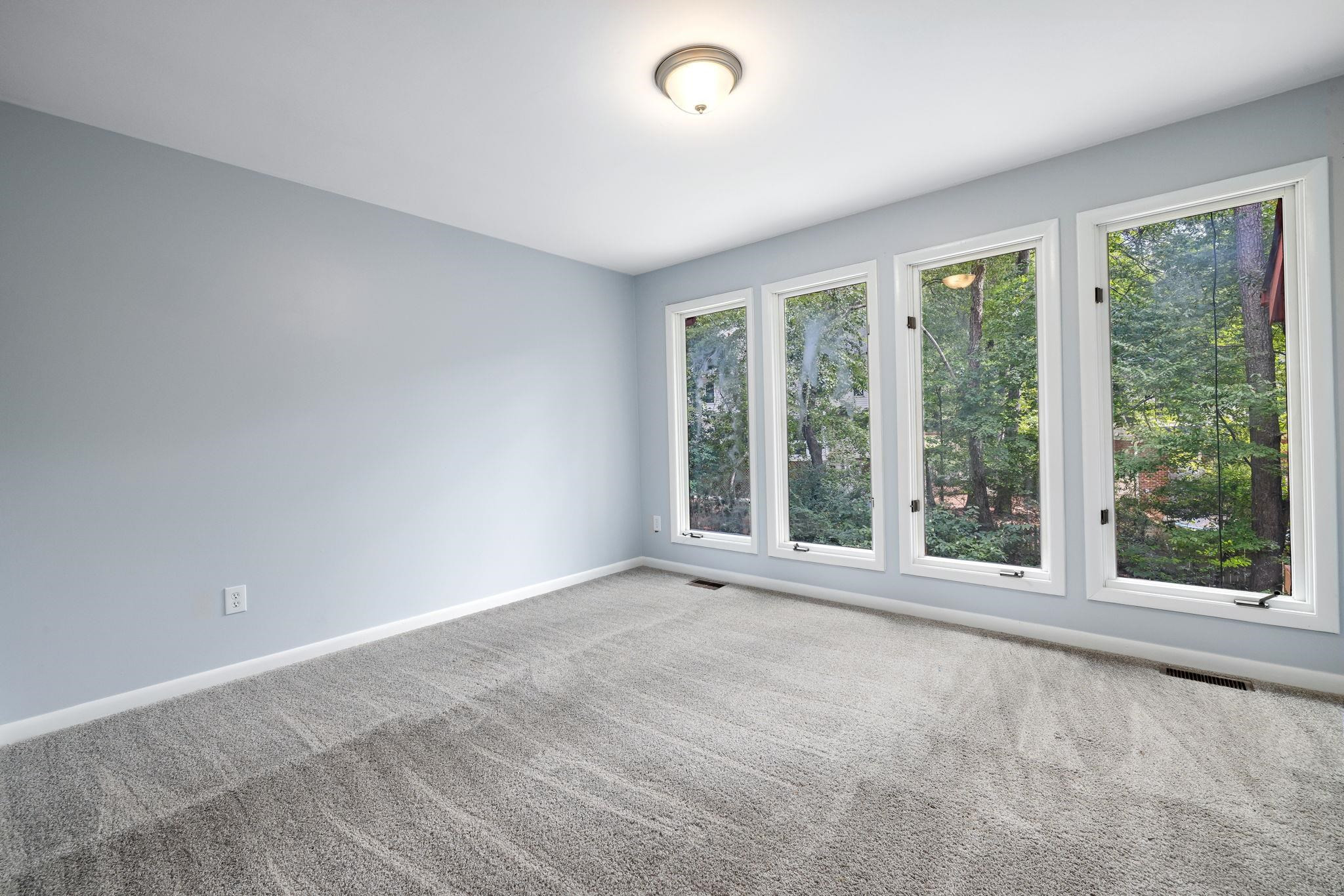 8028 Mourning Dove Road Raleigh, NC 27615 - Photo 24 of 35 a view of an empty room with a window