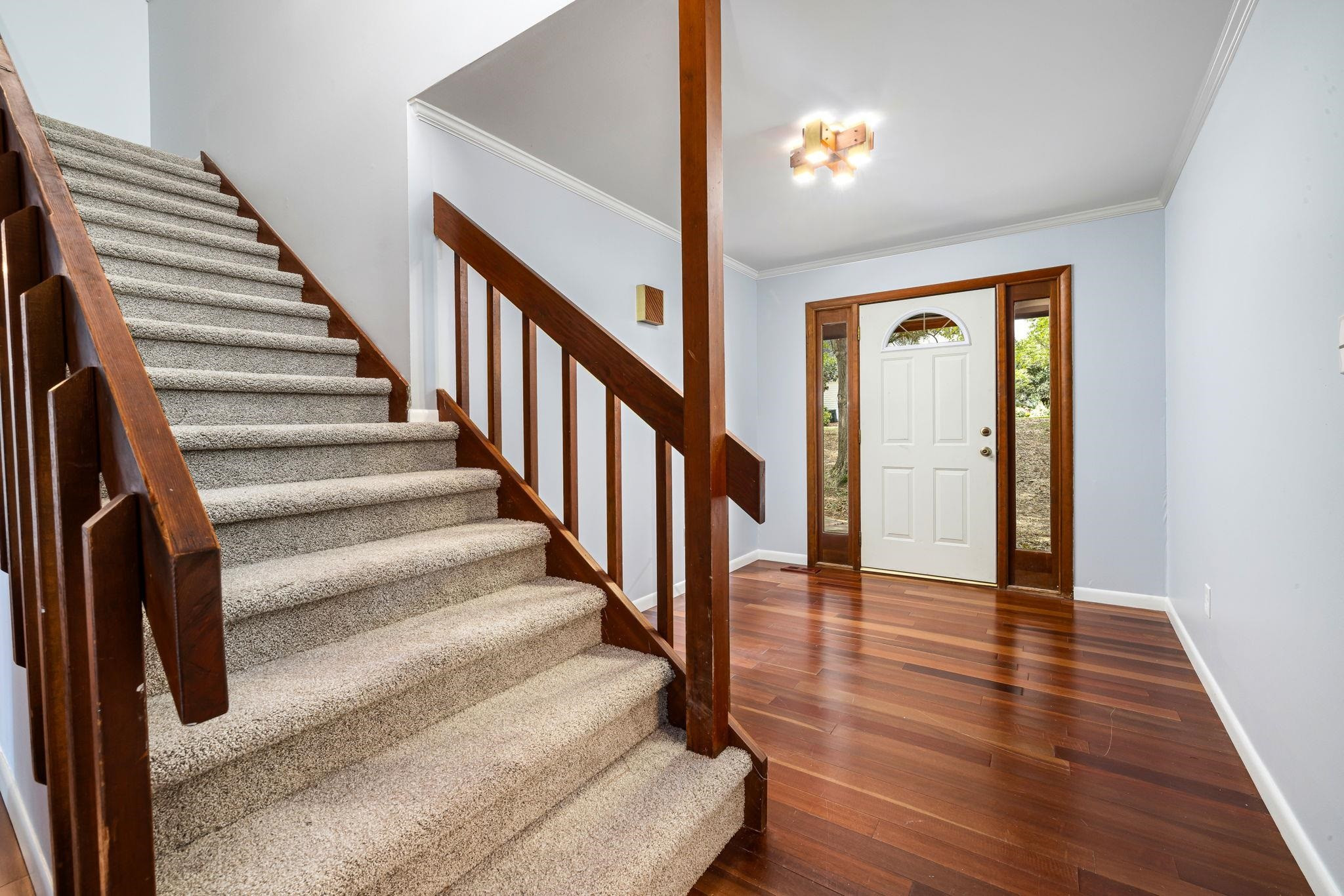 8028 Mourning Dove Road Raleigh, NC 27615 - Photo 5 of 35 a view of entryway and hall with wooden floor