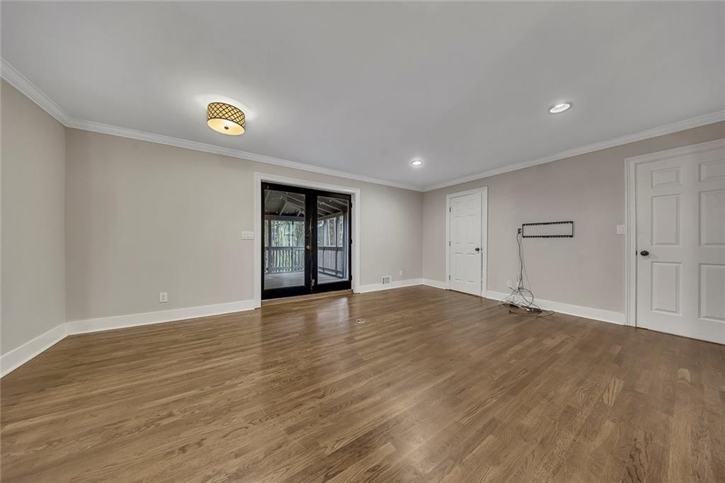 2290 Beaver Creek Road Smyrna, GA 30080 - Photo 14 of 66 a view of an empty room with wooden floor and closet
