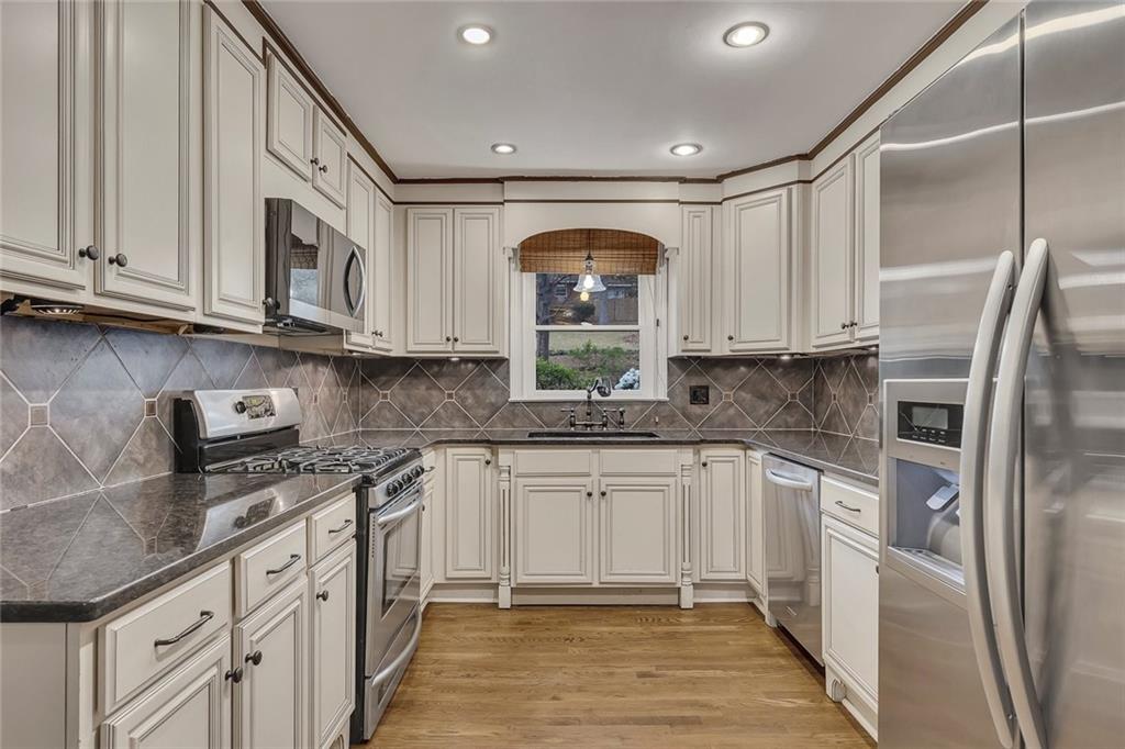2290 Beaver Creek Road Smyrna, GA 30080 - Photo 15 of 66 a kitchen with stainless steel appliances granite countertop a refrigerator sink and cabinets
