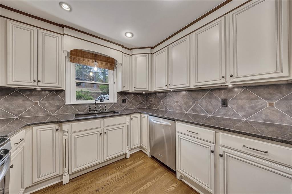 2290 Beaver Creek Road Smyrna, GA 30080 - Photo 17 of 66 a kitchen with white cabinets and white appliances
