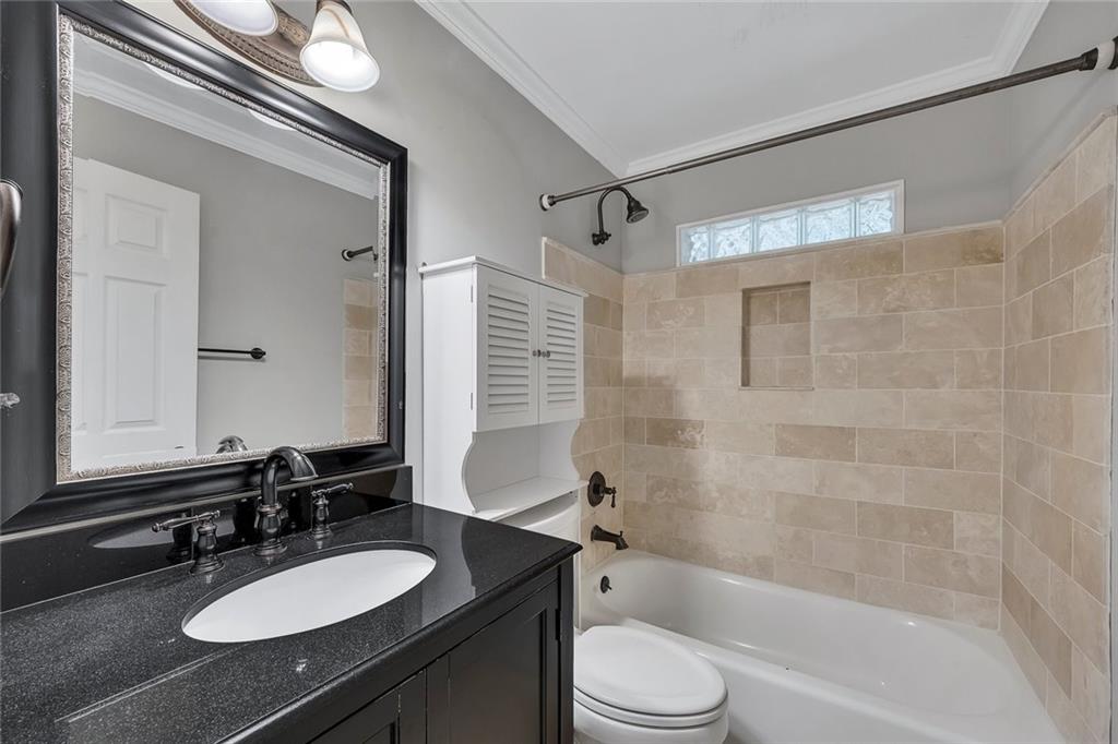 2290 Beaver Creek Road Smyrna, GA 30080 - Photo 25 of 66 a bathroom with a sink a toilet a mirror and shower