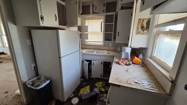 a view of living room with furniture and a window