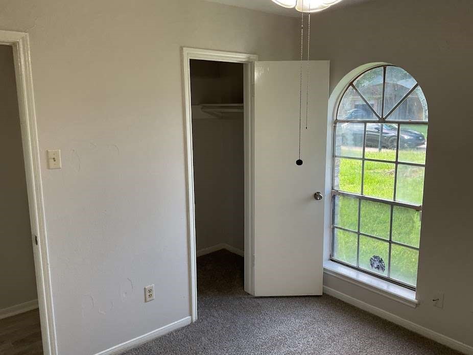 117 Bastrop Street Angleton, TX 77515 - Photo 4 of 15 a view of room with window and hallway