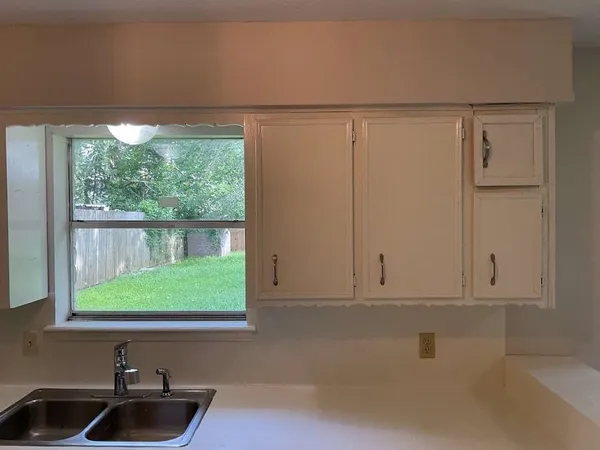 a view of a sink and a window