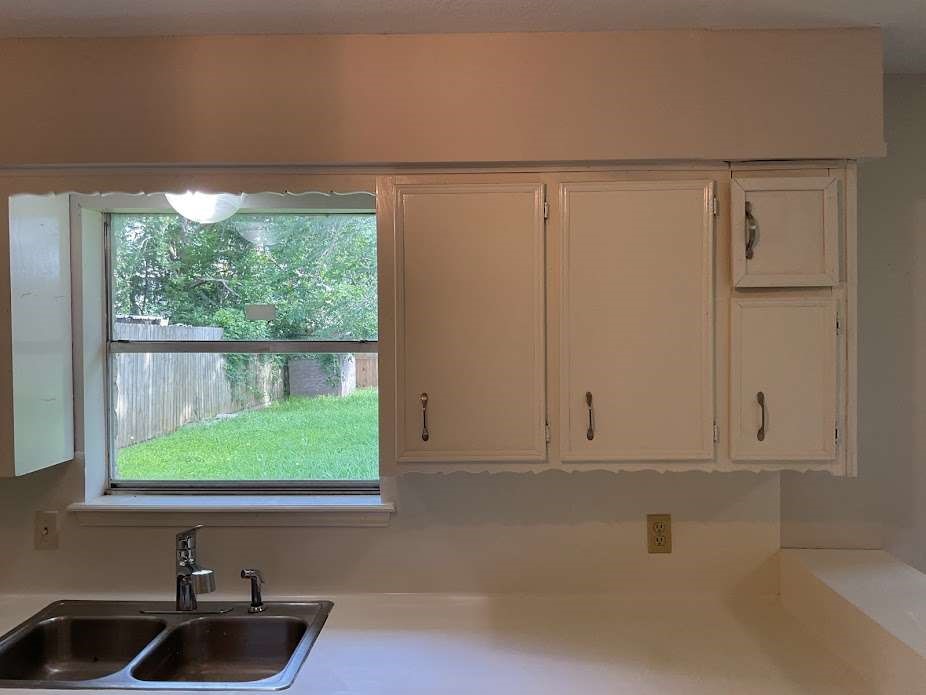 117 Bastrop Street Angleton, TX 77515 - Photo 5 of 15 a view of a sink and a window