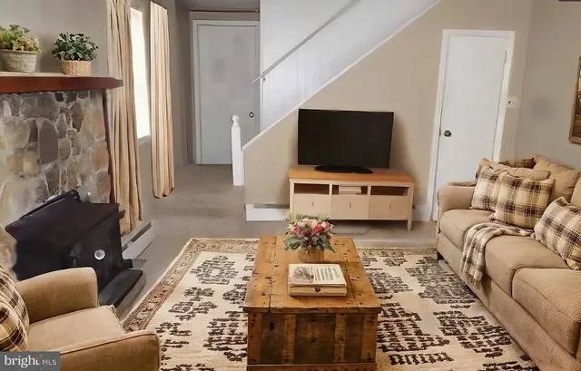 a living room with furniture and a flat screen tv