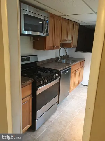 a kitchen with a stove and a microwave