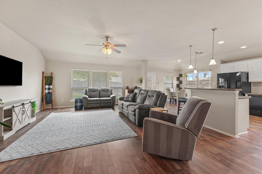 409 Harding Lane Lavon, TX 75166 - Photo 15 of 34 Open-concept living area featuring wood-finish flooring, recessed lighting, and a ceiling fan