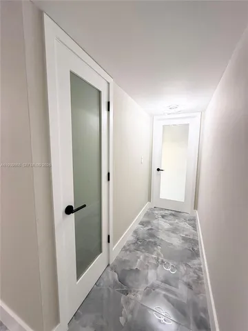 a bathroom with a shower and a toilet