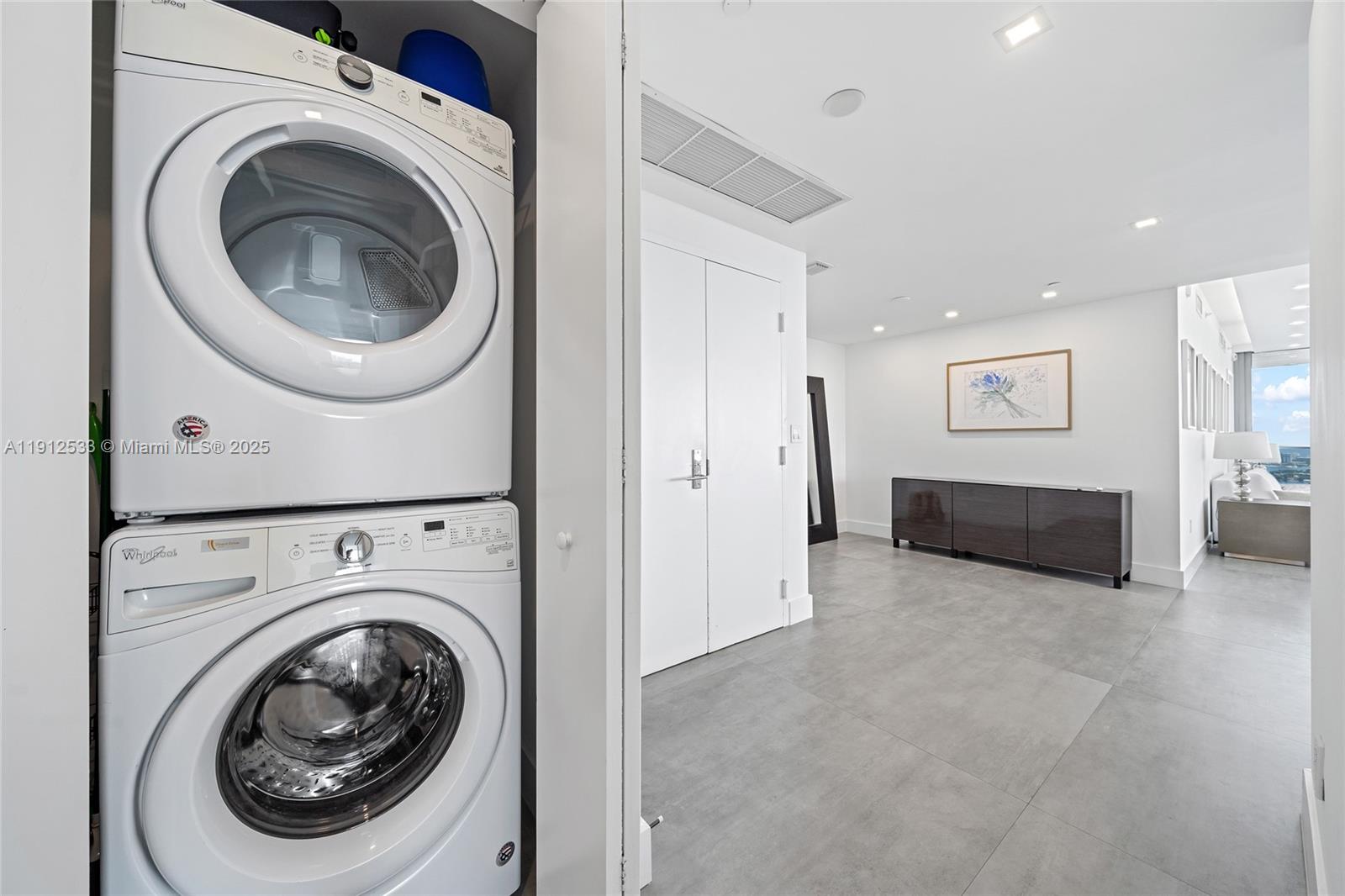 488 Northeast 18th Street, Unit 4612 Miami, FL 33132 - Photo 19 of 42 a view of a hallway with washer and dryer