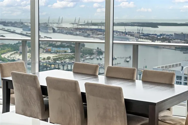 a roof deck with furniture and garden view