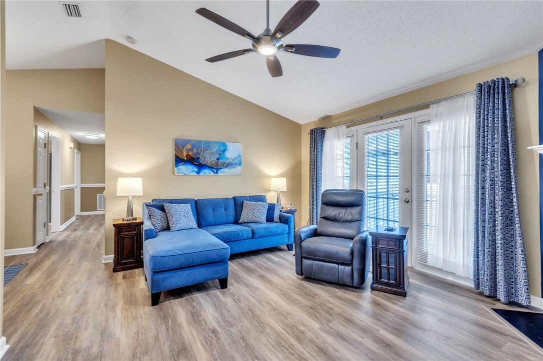 706 Pelham Square Way Greer, SC 29650 - Photo 5 of 20 This living area features a bright and open atmosphere with easy access to the outdoors.