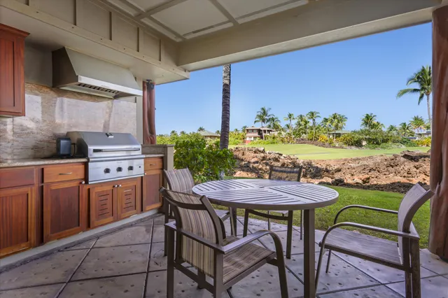 a view of a chairs and table in the patio