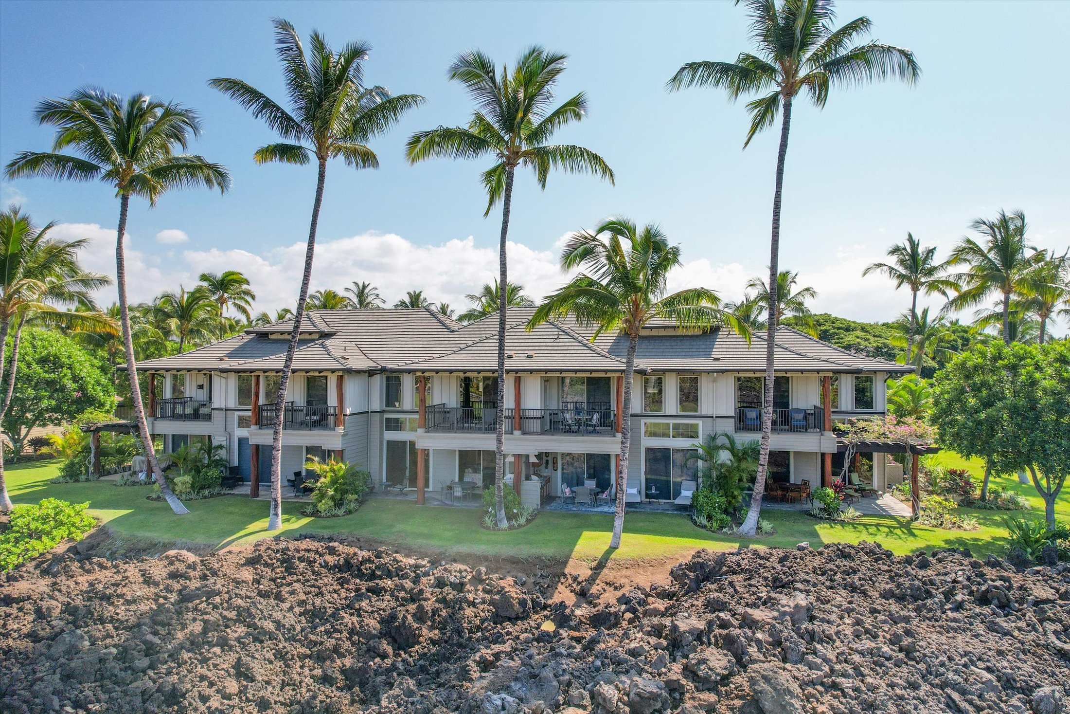 68-1122 Na Ala Hele Road, Unit G3 Kamuela, HI 96743 - Photo 2 of 30 a front view of a house with a garden