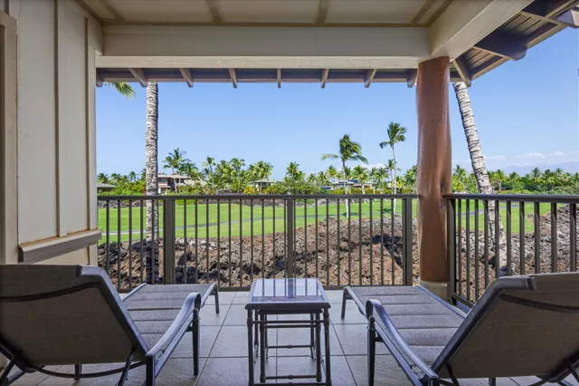 a view of a balcony with chairs