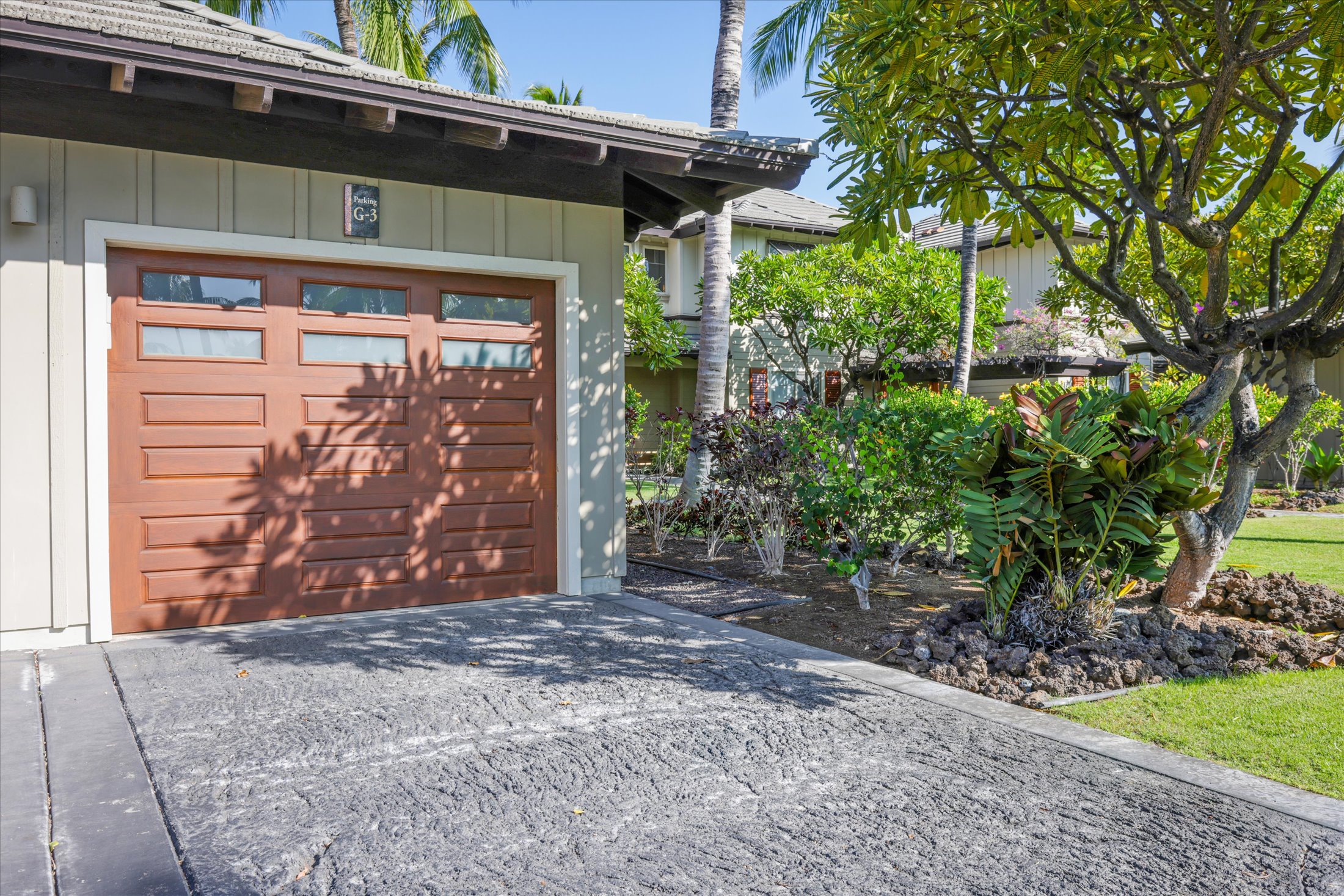 68-1122 Na Ala Hele Road, Unit G3 Kamuela, HI 96743 - Photo 4 of 30 a front view of a house with garden