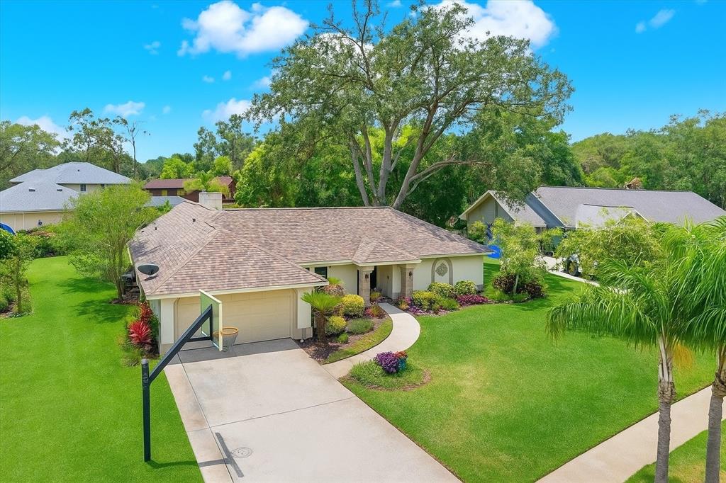 a view of backyard with swimming pool and patio