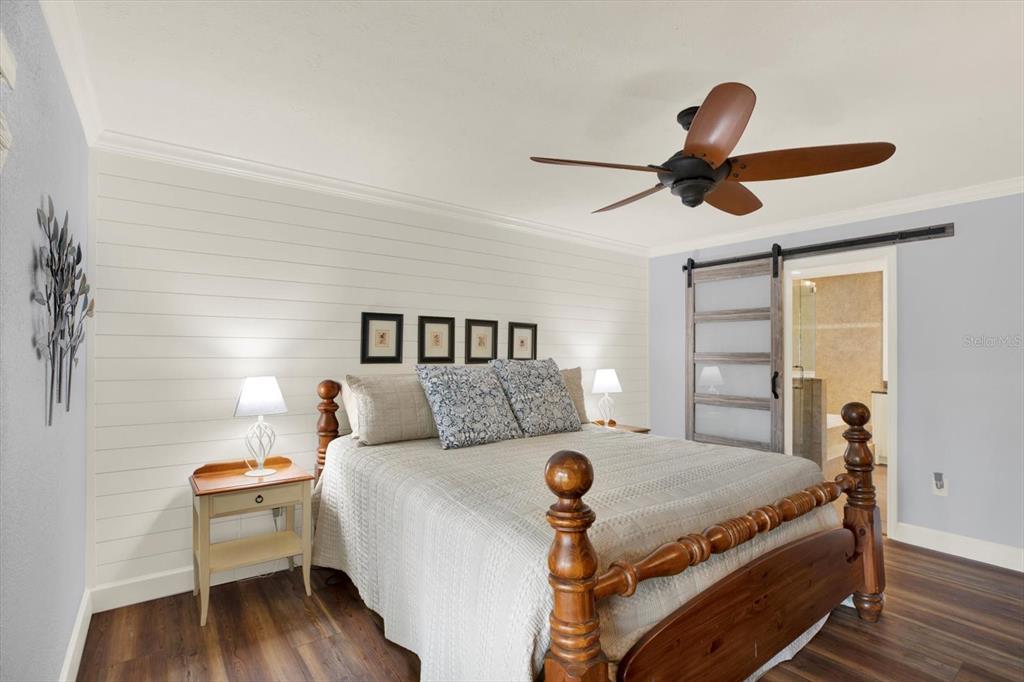 2806 Fairway View Drive Valrico, FL 33596 - Photo 11 of 45 a bed room with a bed and a ceiling fan