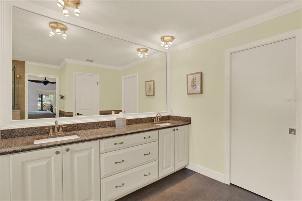 2806 Fairway View Drive Valrico, FL 33596 - Photo 13 of 45 a bathroom with a granite countertop sink double and mirror