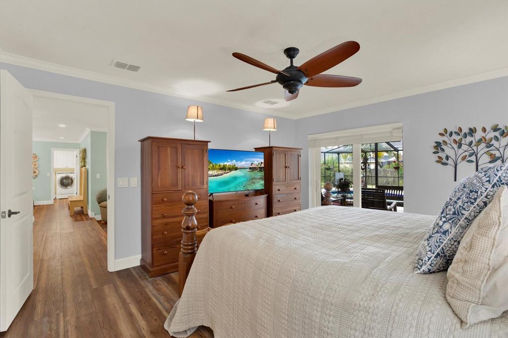 2806 Fairway View Drive Valrico, FL 33596 - Photo 15 of 45 a bed room with a bed and a chandelier